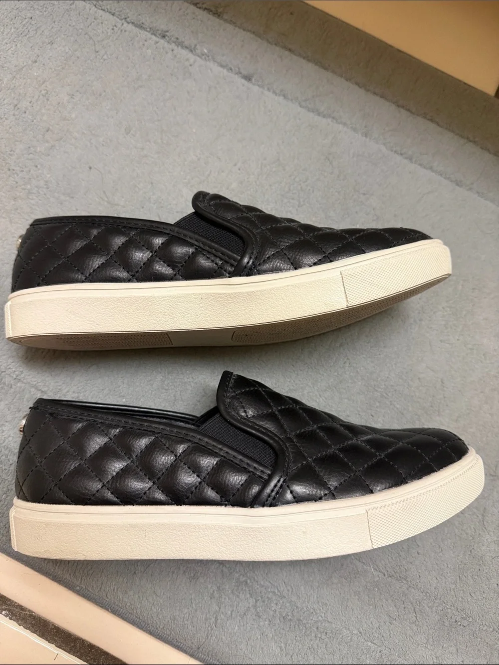 Steve Madden Black Quilted Slip-On Sneakers with White Sole